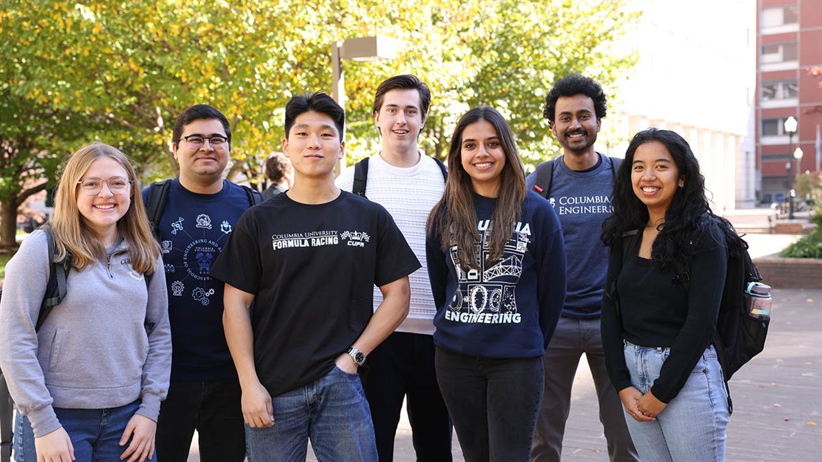 Seven engineering students standing together outdoors